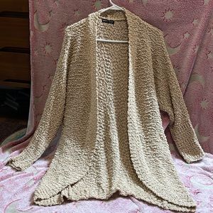 Woman’s tan cardigan